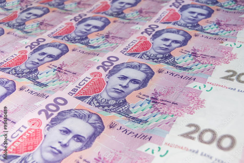 Obraz premium Pile of ukrainian money hryvnia, denomination of 200 UAH