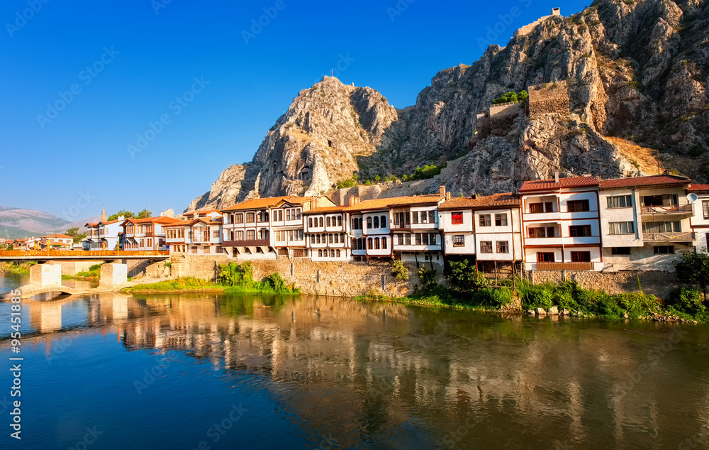 Fototapeta premium Traditional ottoman houses reflecting in the river, Amasya, Turkey