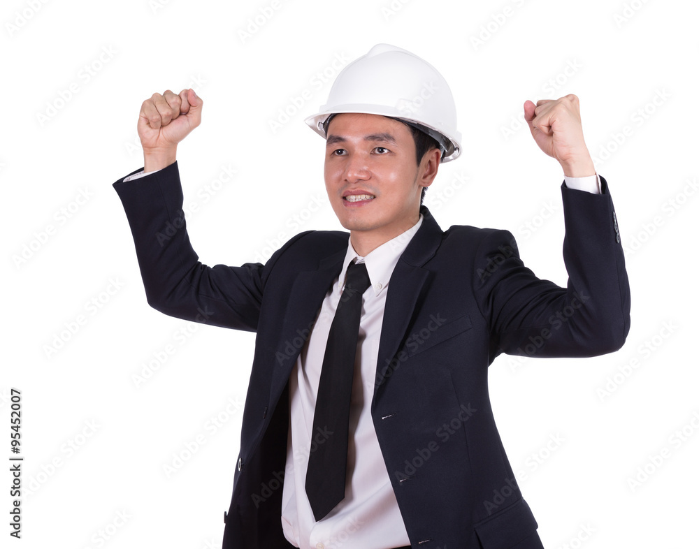 Happy young engineer celebrating with arm raised, concept of suc Happy young engineer celebrating with arm raised, concept of suc