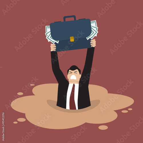 Businessman with briefcase full of money sinking in a quicksand