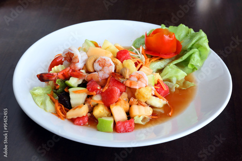 Spicy fruit salad with prawns in thai style - som tum