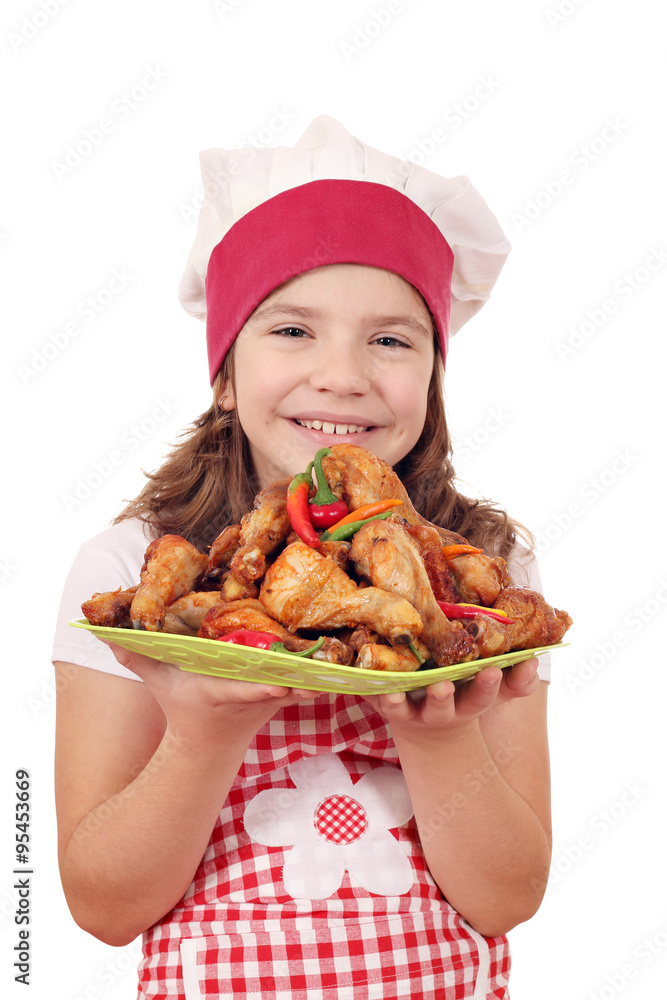 happy little girl cook with roasted chicken drumstick on plate happy little girl cook with roasted chicken drumstick on plate