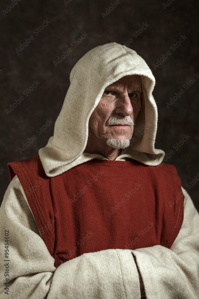 Official portrait of monastic. Studio shot against dark wall. Official portrait of monastic. Studio shot against dark wall.