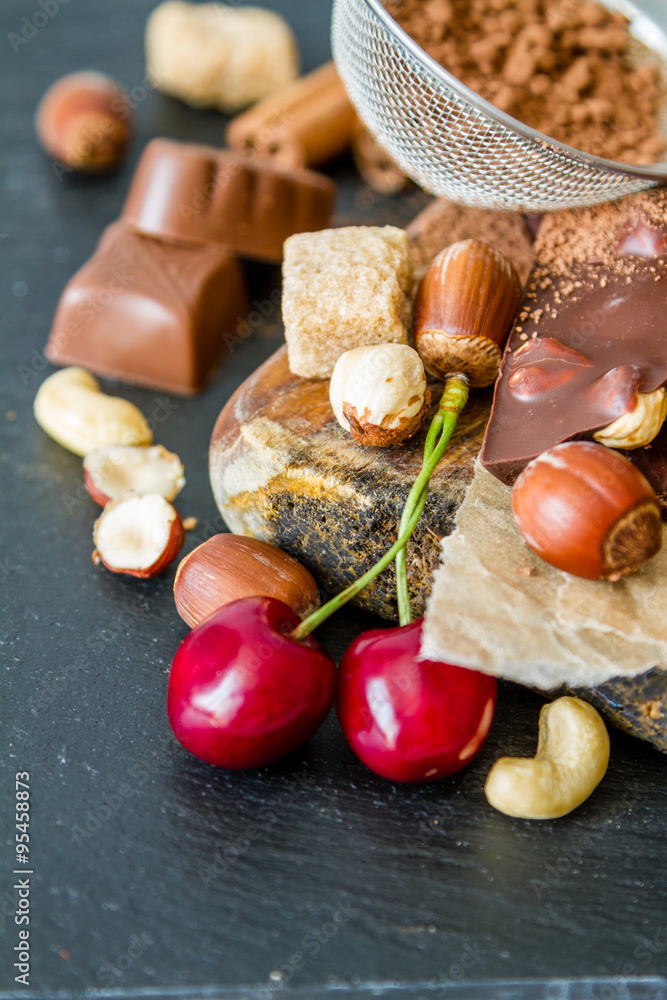 Selection of chocolate and nuts, copy space Selection of chocolate and nuts, copy space