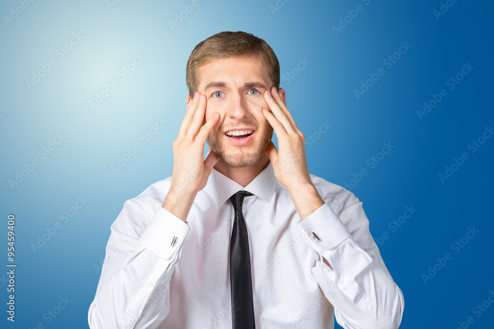 Scared and astonished young businessman Scared and astonished young businessman
