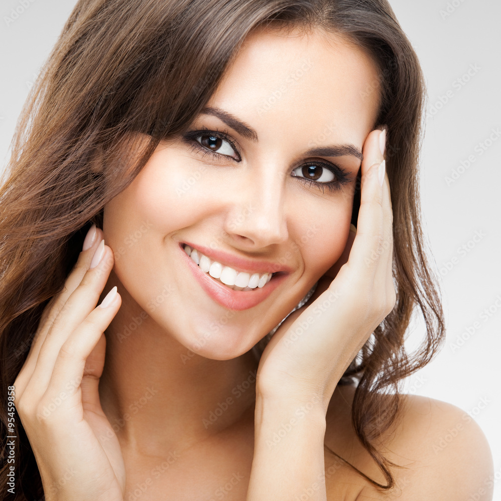 Portrait of beautiful woman, on grey Portrait of beautiful woman, on grey