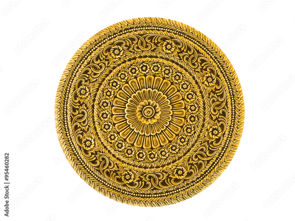 Fototapeta premium Gold lacquered metal art piece engraved in Thai floral design