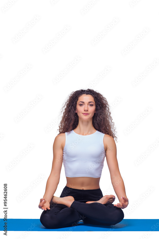 Studio shot of a young fit woman doing yoga exercises. Studio shot of a young fit woman doing yoga exercises.