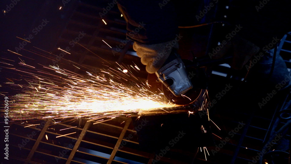 Worker cutting the metal Worker cutting the metal