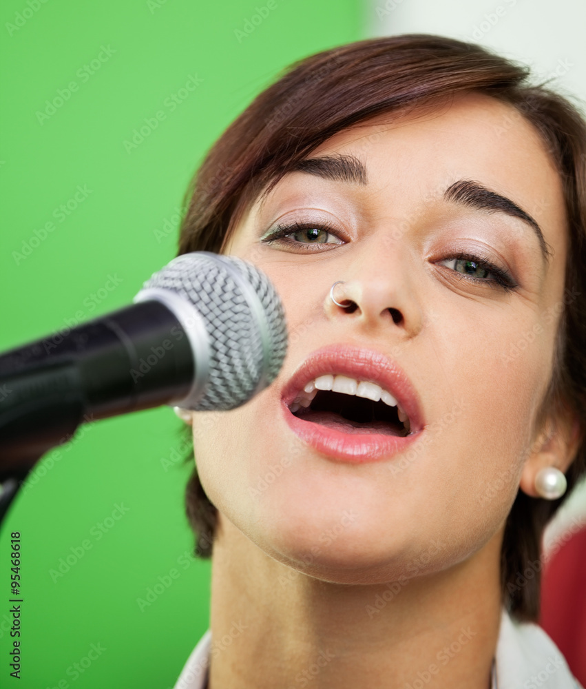 Portrait Of Woman Singing In Recording Studio Portrait Of Woman Singing In Recording Studio