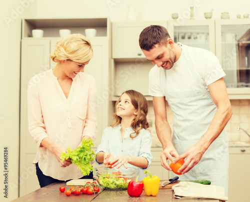 happy family making dinner in kitchen