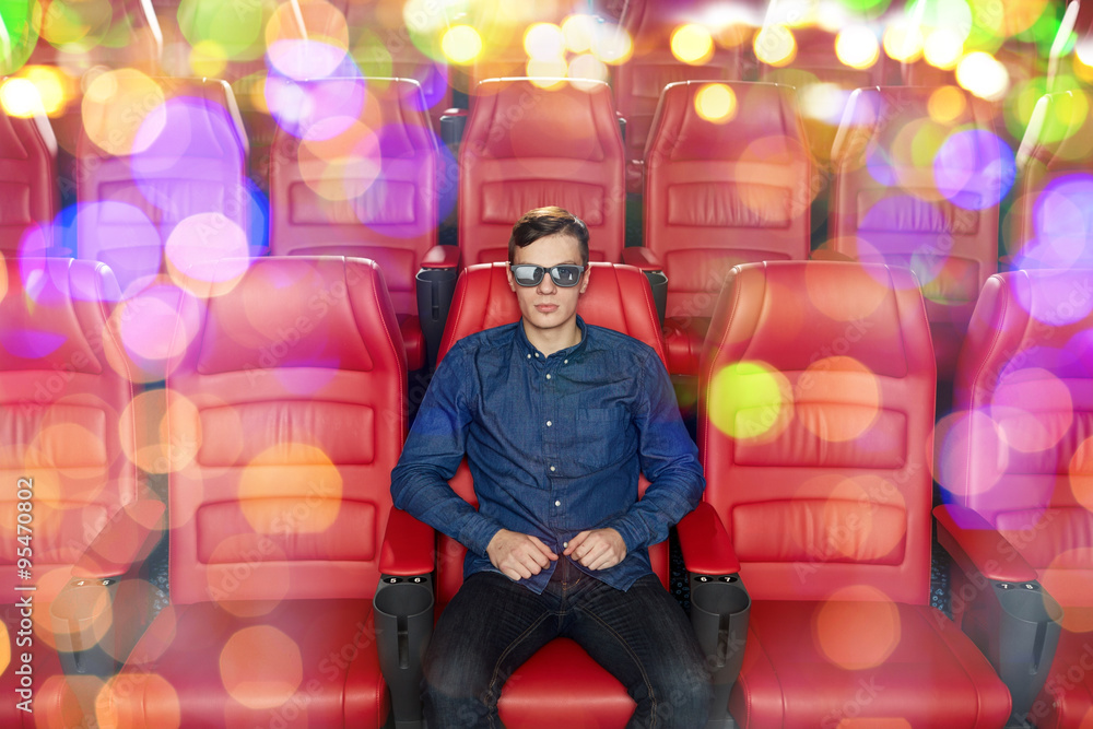 young man watching movie in 3d theater young man watching movie in 3d theater