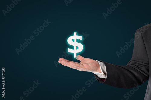 Businessman holding a dollar icon