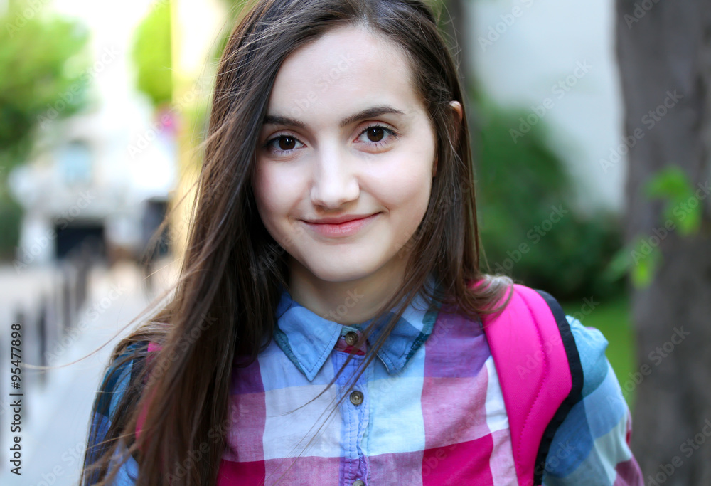 Portrait of beautiful girl in the city