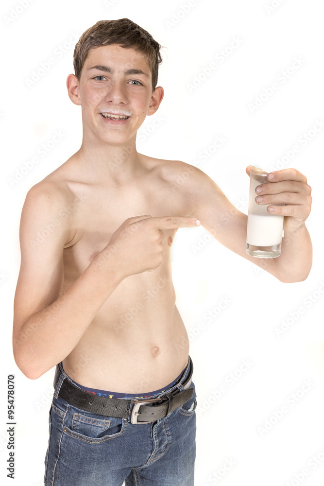 Teen Boy With Milk Moustache Pointing At Glass Of Milk Teen Boy With Milk Moustache Pointing At Glass Of Milk