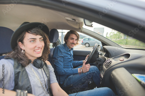 Couple having fun driving car