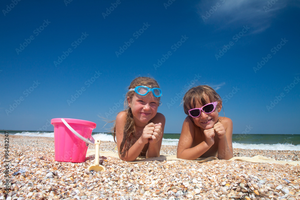Two adorable toddler girl on sand beach Two adorable toddler girl on sand beach