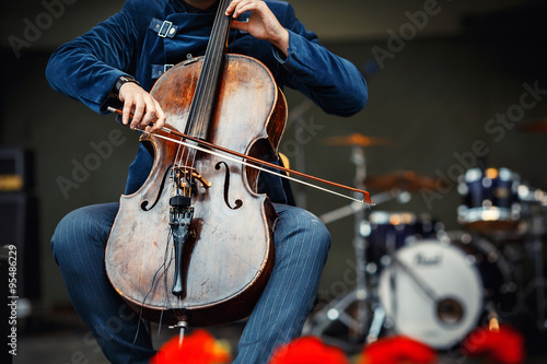 Symphony concert, a man playing the cello