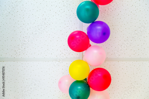 Colorful balloons on ceiling