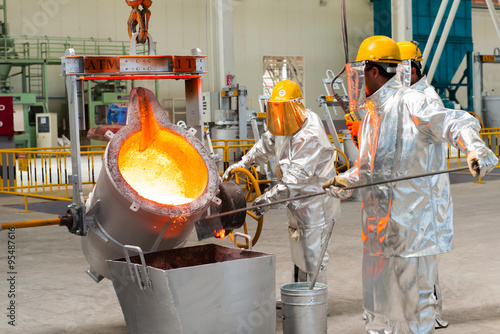 Tableau sur toile Baku, Azerbaijan-October 2015- workers melting metal Smelting in a metallurgical plant