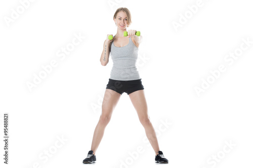 Sporty woman doing dumbbell training