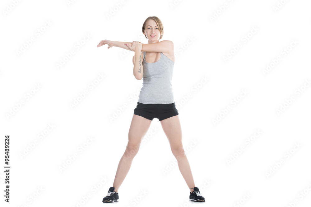 Sporty woman stretching shoulder blade Sporty woman stretching shoulder blade