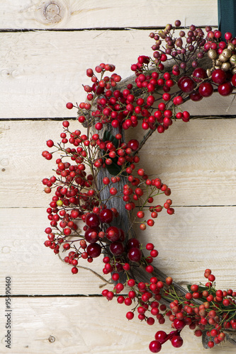 Christmas wreath of evergreen and nandian network berries photo