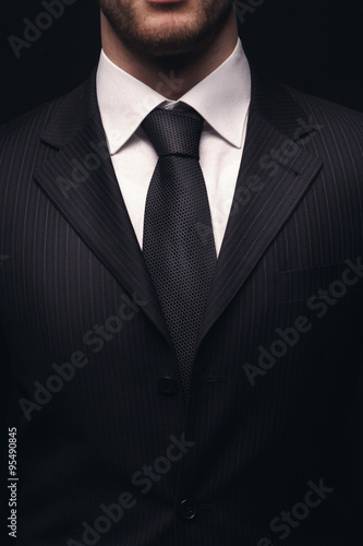 closeup of young businessman suit