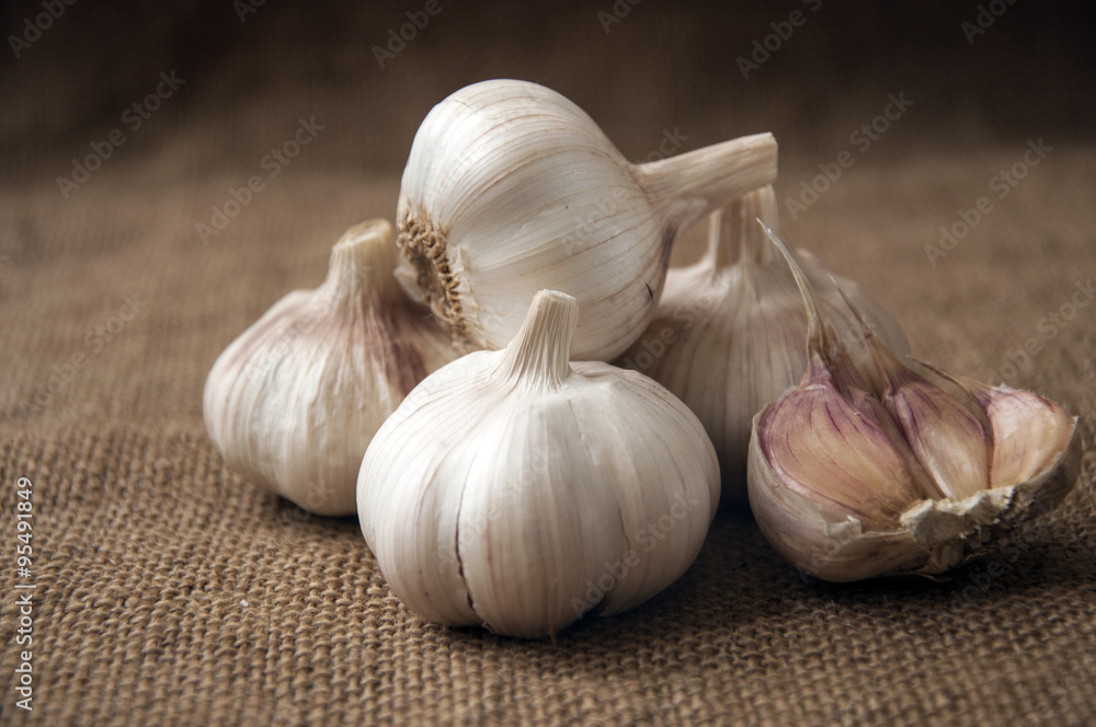 Garlic close-up on sacking. burlap background Garlic close-up on sacking. burlap background