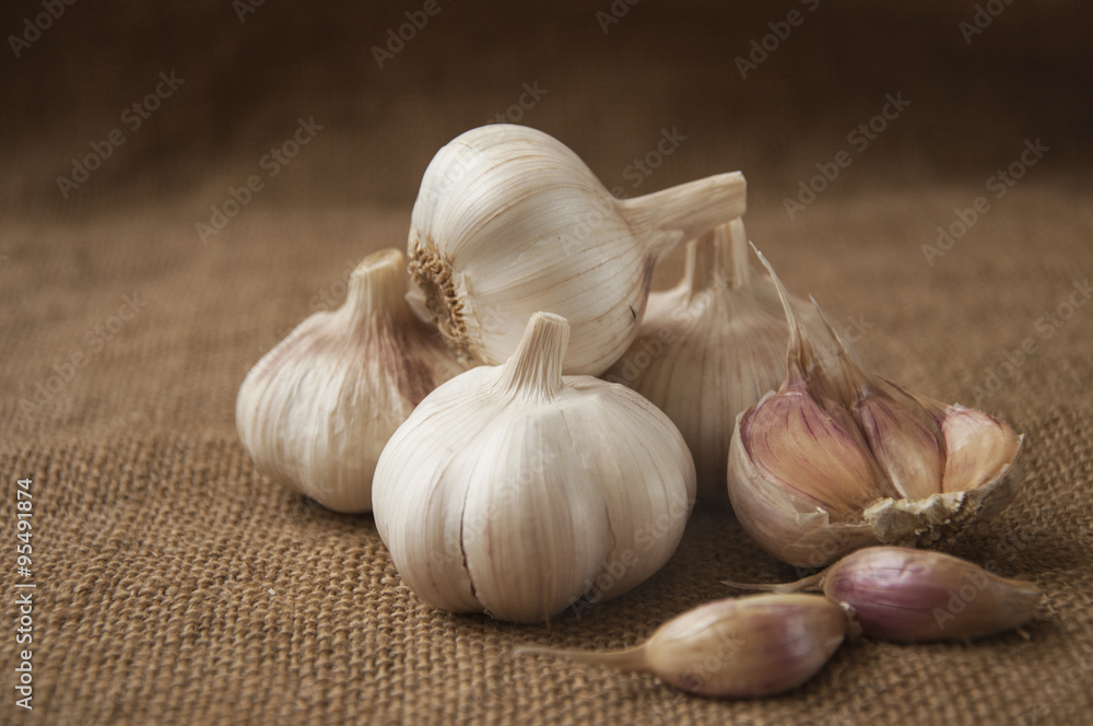 Garlic close-up on sacking. burlap background Garlic close-up on sacking. burlap background