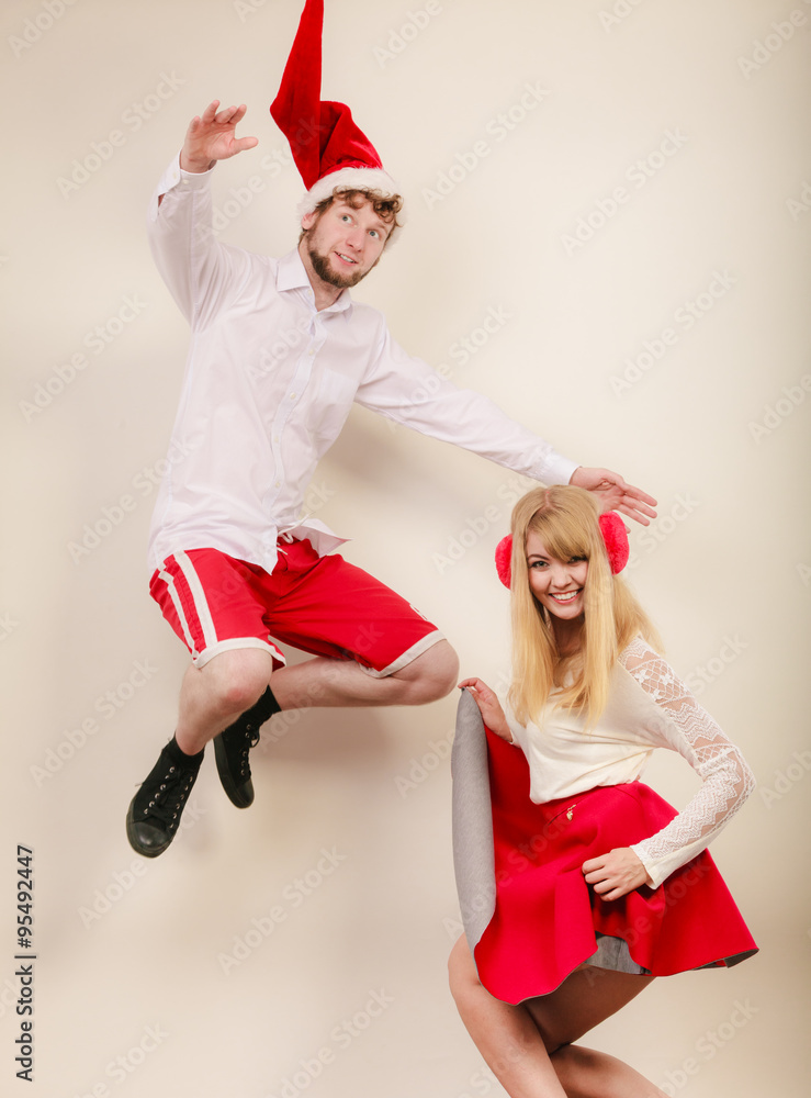 Obraz premium Happy active couple dancing and jumping.