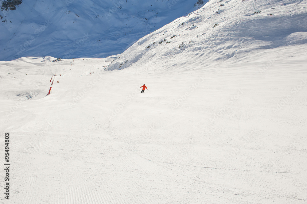 Snowy ski piste on a mountain