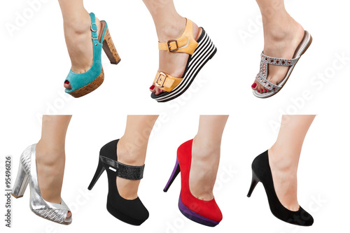 Female feet in different shoes and sandals on a white background