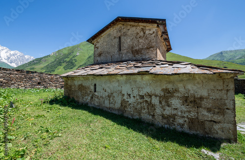 Lamaria church in Zhibiani - one of four villages community called Ushguli in Upper Svanetia region, Georgia photo