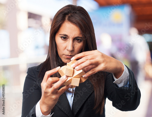 Принти на полотні cool business-woman with puzzle cube