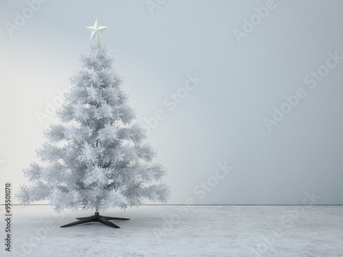 Decorated white christmas tree in white room