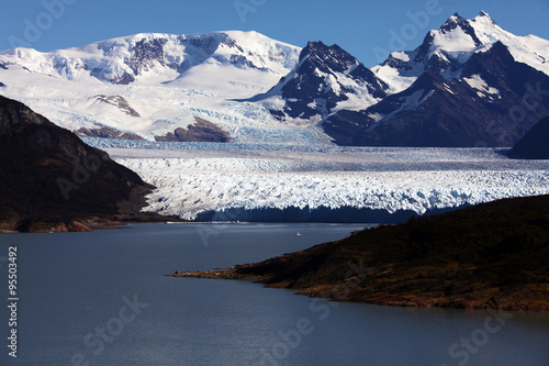 Boat in the distance sailing near Perito Moreno glacier  Patagonia  Argentina