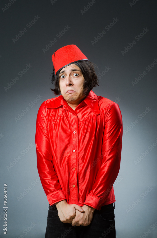 Man wearing red fez hat Man wearing red fez hat