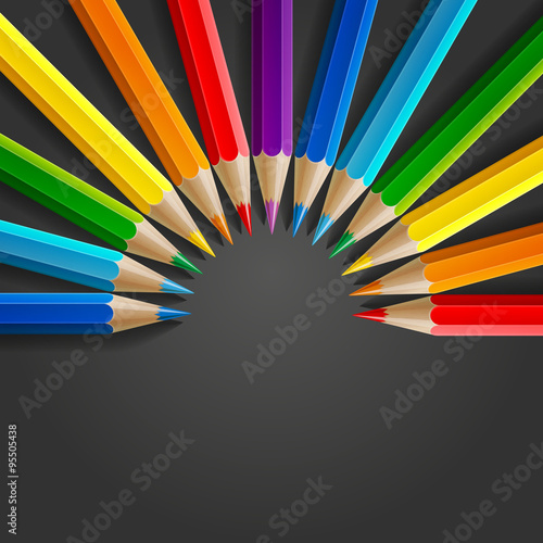 Semicircle of rainbow colored pencils with realistic shadow on dark grey background photo