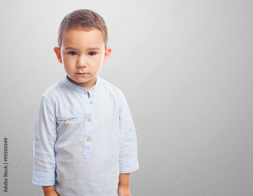 portrait of a little boy with serious gesture portrait of a little boy with serious gesture