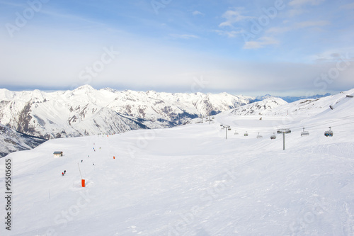 View down a snowy ski piste