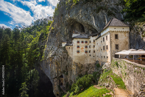 Renaissance Castle Built Inside Rocky Mountain in Predjama, Slovenia. Famous Tourist Place in Europe. photo