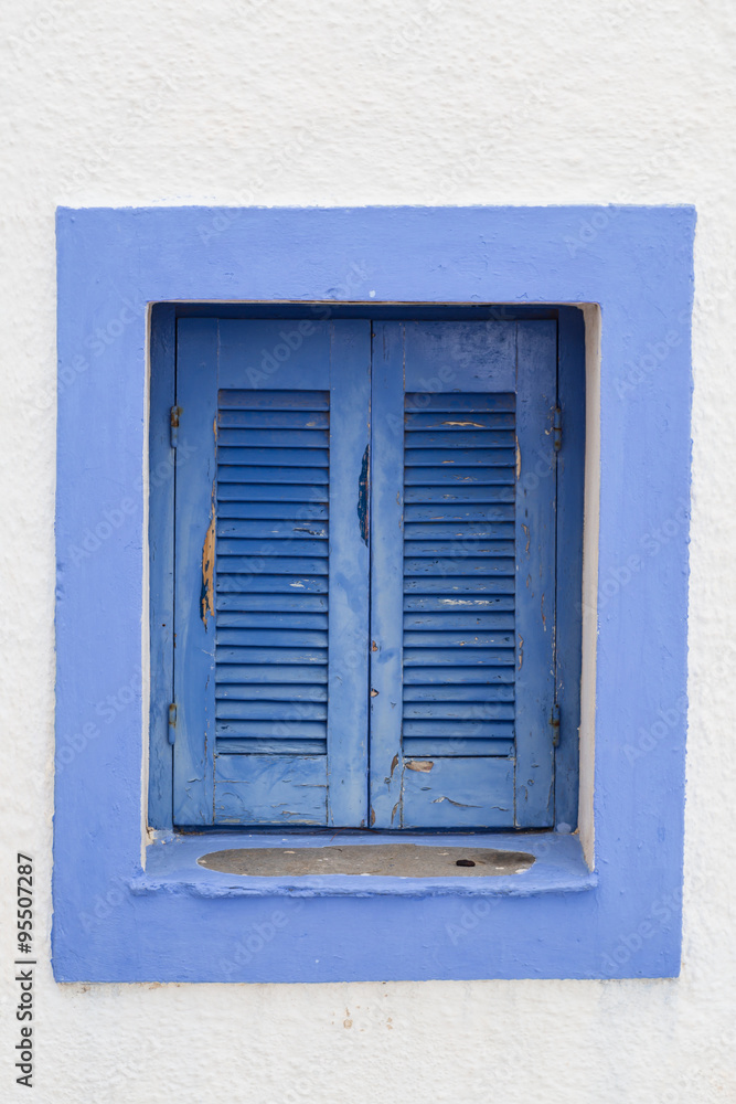 Window with closed blue shutters