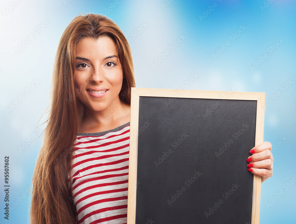 young student holding a little chalkboard closeup young student holding a little chalkboard closeup