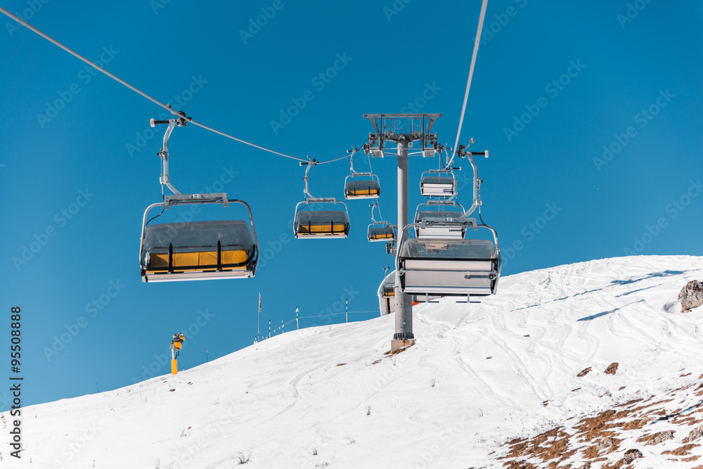 Ski lifts durings bright winter day Ski lifts durings bright winter day