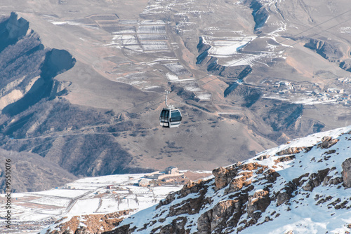 Ski lifts durings bright winter day photo