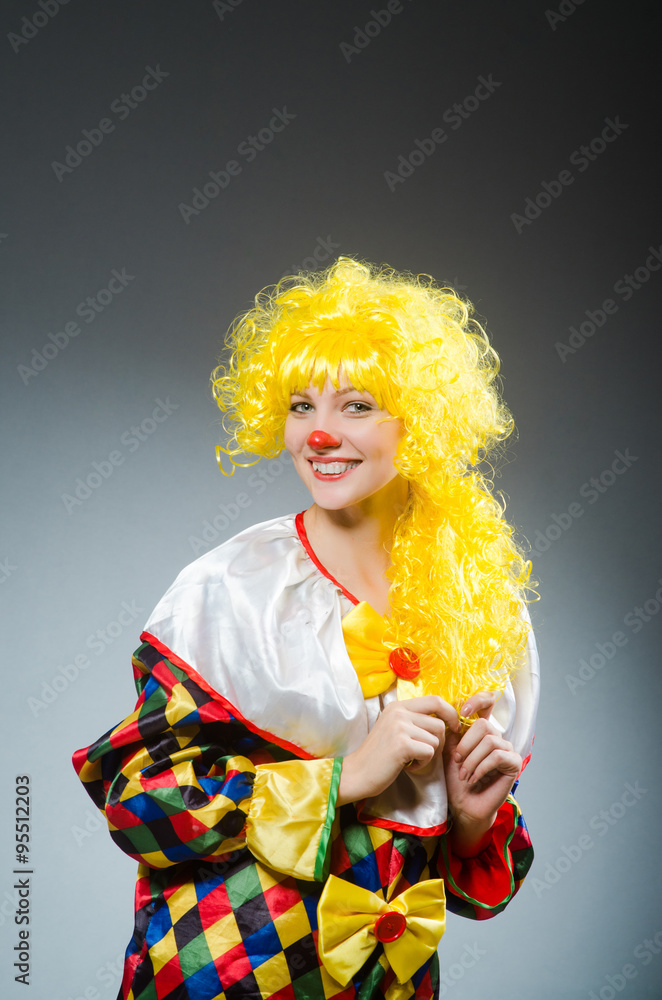 Clown in funny concept on dark background Clown in funny concept on dark background