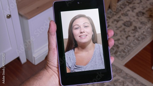 A person gets a pop-up warning about nearly reaching the monthly data limit while video chatting.	 photo