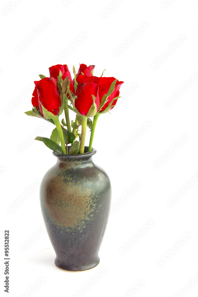 Stock Photo:.Beautiful red roses in a vase isolated on white