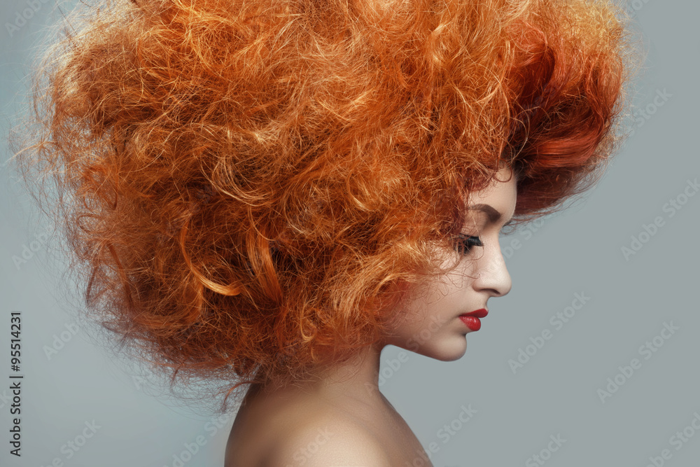 Beautiful redhead Woman with Clean Fresh Skin. Close up Portrait. Girl Face. Perfect Skin. Professional Makeup. shiny highlighter on skin, sexy gloss lips and curly hair on a gray background Beautiful redhead Woman with Clean Fresh Skin. Close up Portrait. Girl Face. Perfect Skin. Professional Makeup. shiny highlighter on skin, sexy gloss lips and curly hair on a gray background